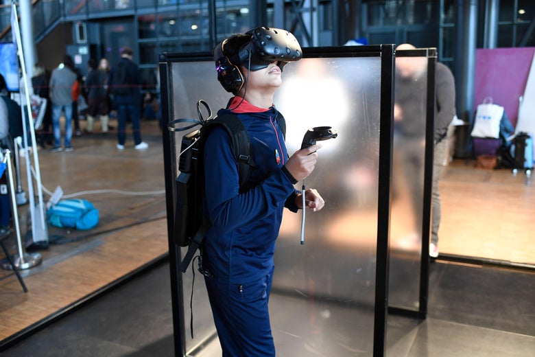 A boy tries a virtual reality headset at Paris Comic Con on Oct. 27, 2017.